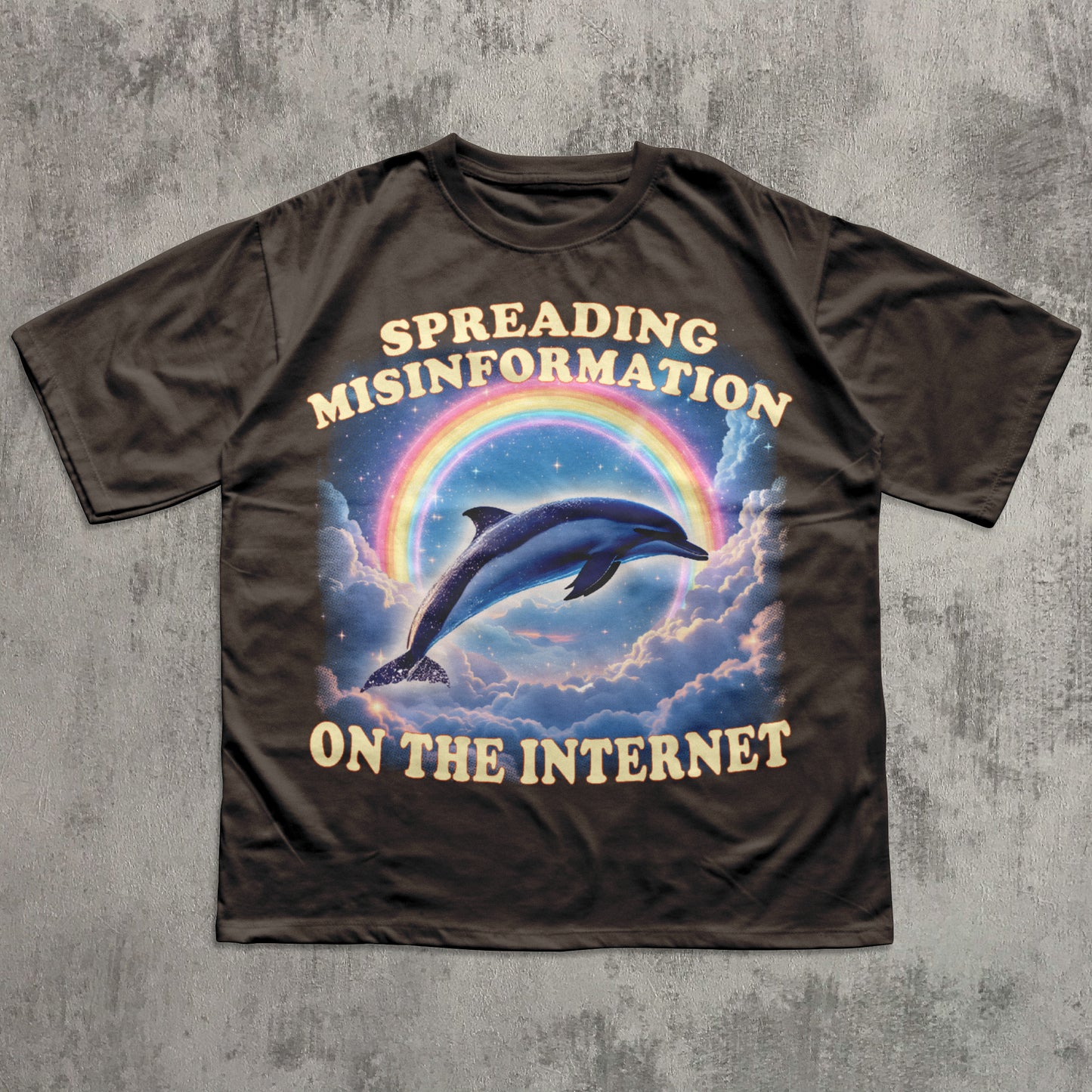 T-shirt with a graphic of a dolphin and rainbow, text 'Spreading Misinformation on the Internet' on a concrete background.