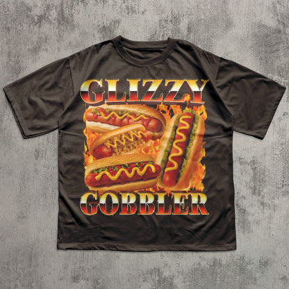 Black t-shirt with a graphic of hot dogs and the text 'Glizzy Gobbler' on a textured gray background.