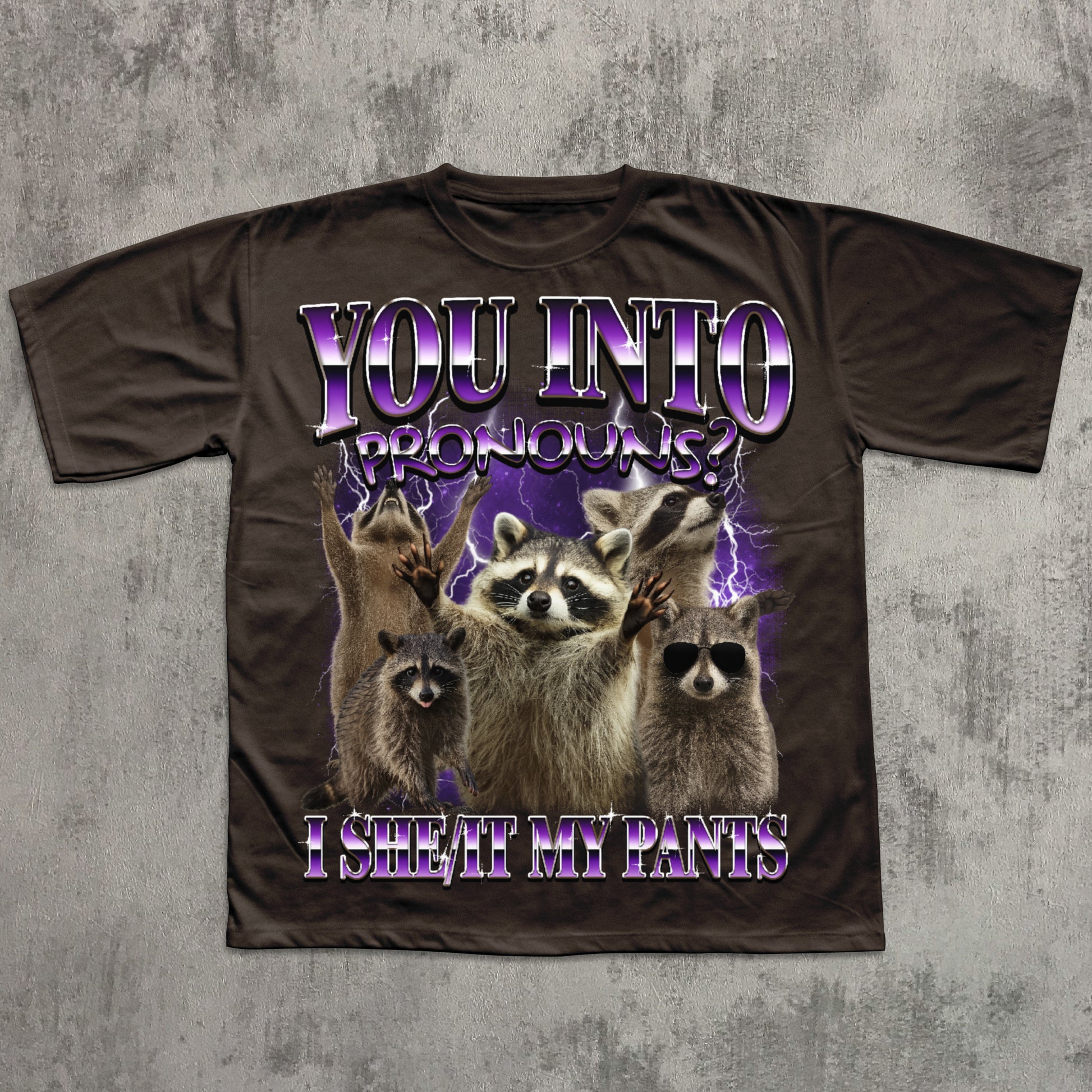 T-shirt with raccoon graphic and humorous text on a textured gray background