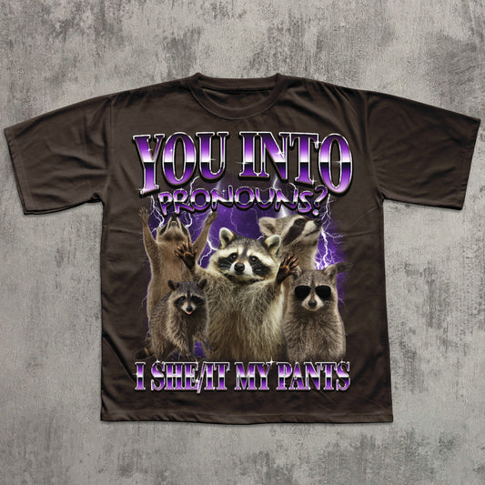 T-shirt with raccoon graphic and humorous text on a textured gray background