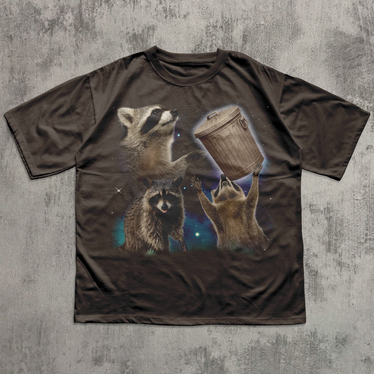 Brown funny t-shirt with raccoon design on a textured gray background