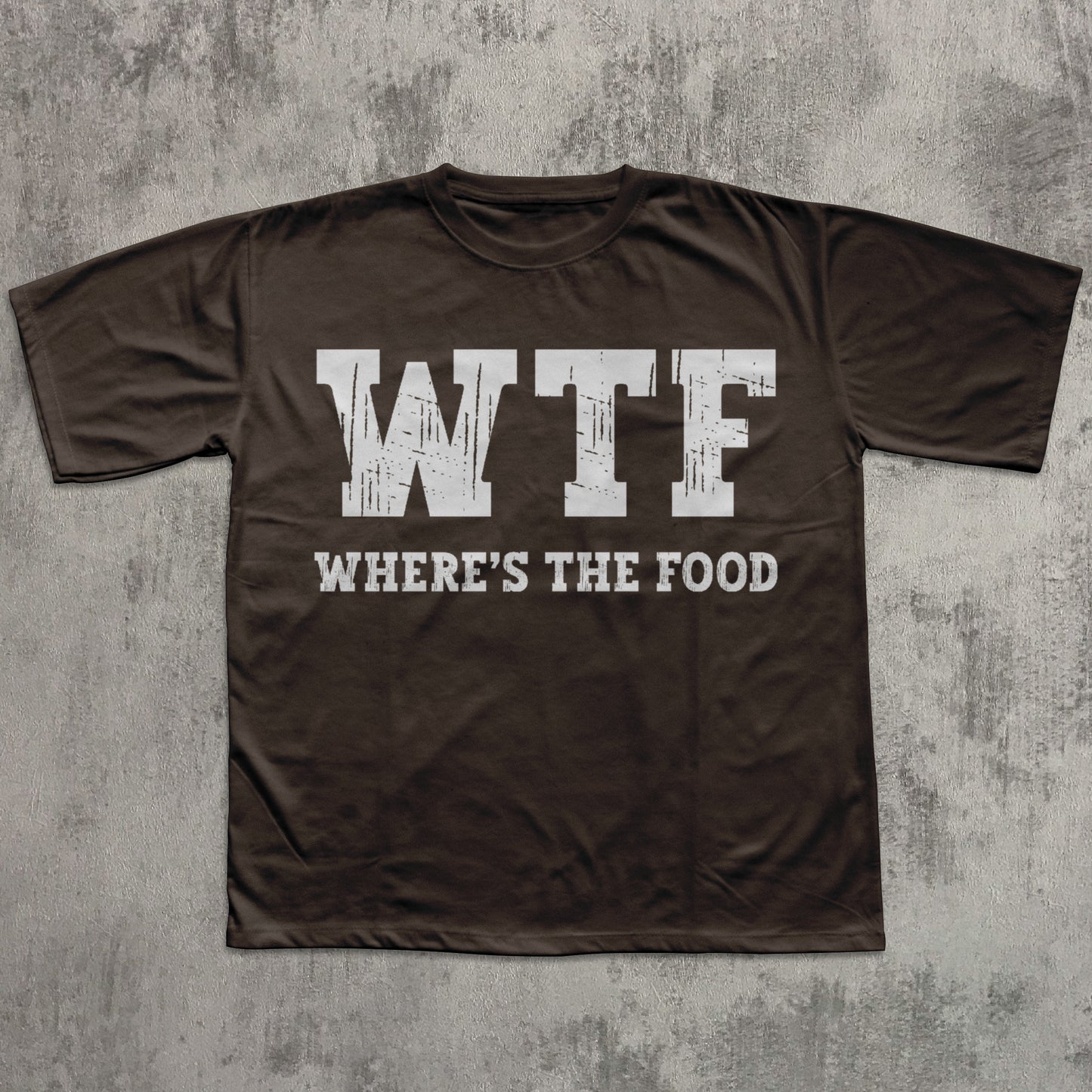 Brown t-shirt with 'WTF WHERE'S THE FOOD' text on a textured gray background