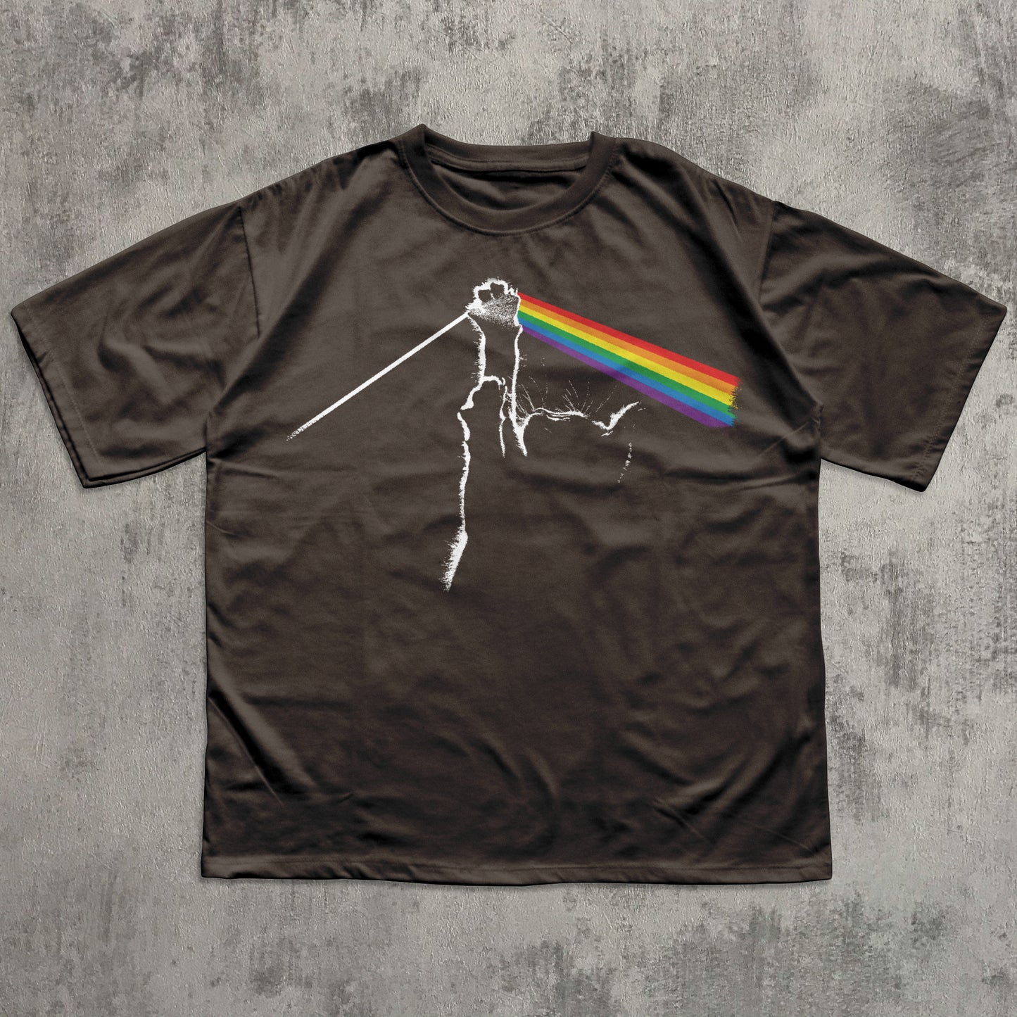 Brown t-shirt with a graphic design on a textured gray background
