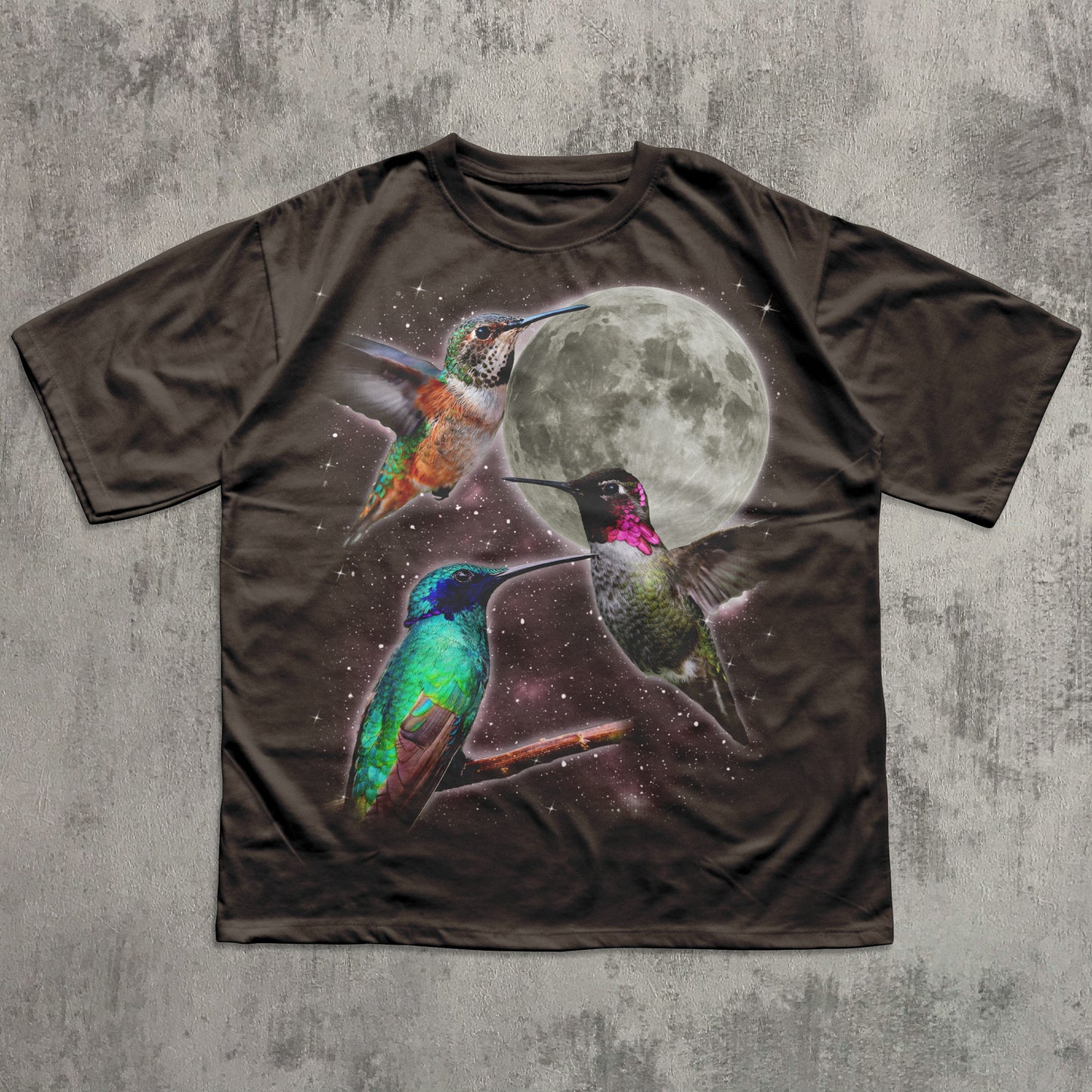 T-shirt with a design of hummingbirds and a moon on a textured gray background