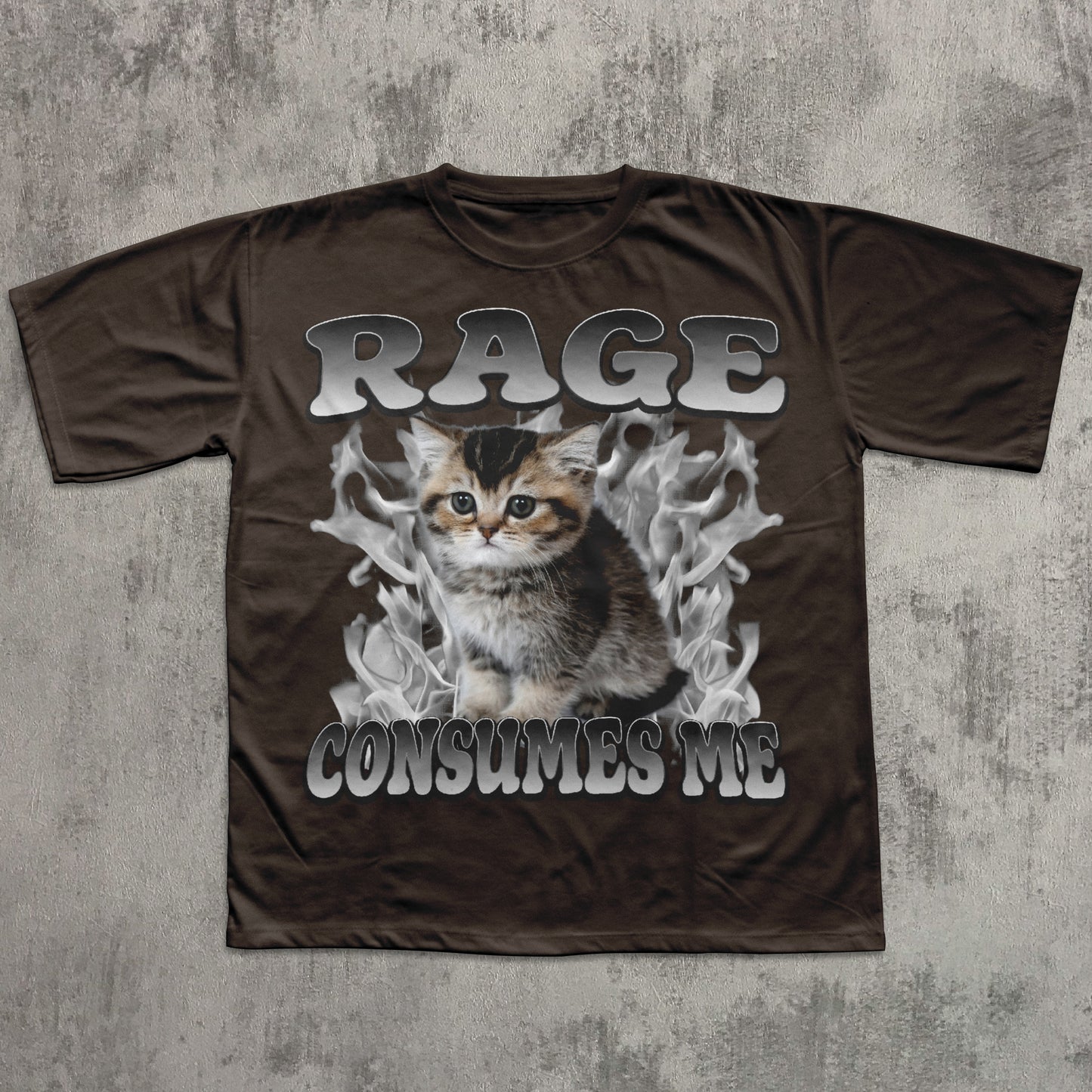 Brown t-shirt with a graphic of a kitten and text 'RAGE CONSUMES ME' on a textured gray background