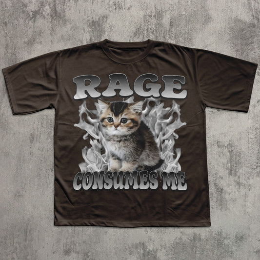 Brown t-shirt with a graphic of a kitten and text 'RAGE CONSUMES ME' on a textured gray background