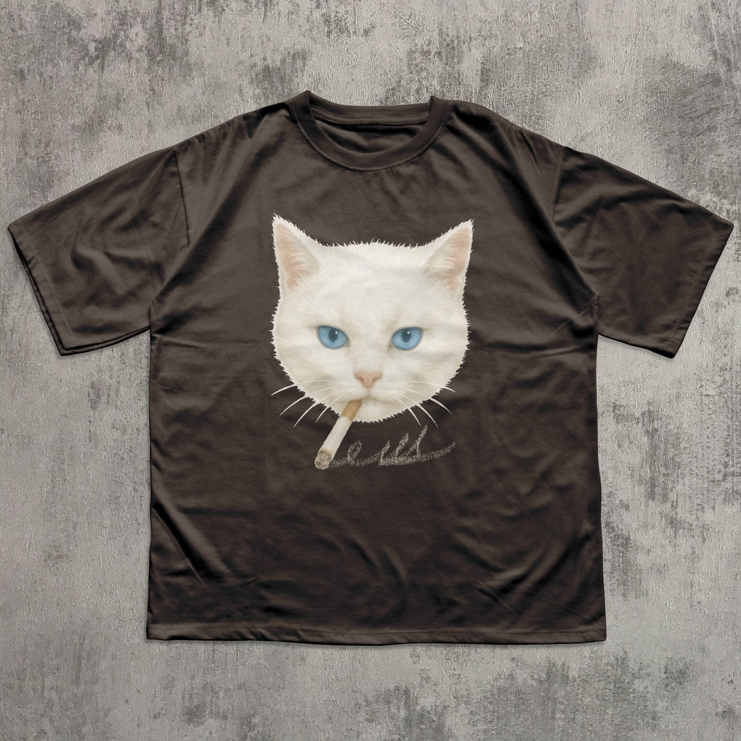 Brown t-shirt with a graphic of a cat smoking a cigarette on a textured gray background