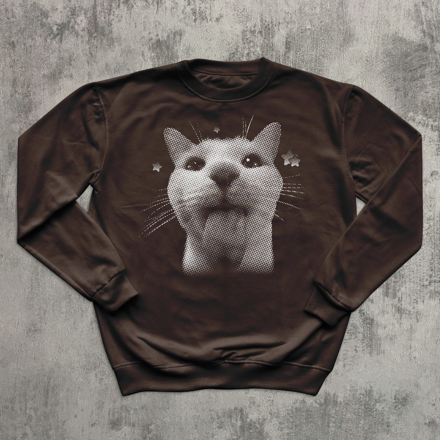 Brown sweatshirt with a cat graphic on a textured gray background