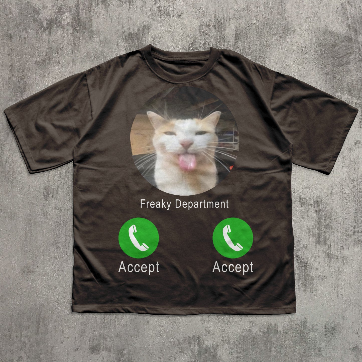 Brown t-shirt with a cat graphic and phone interface design on a textured gray background