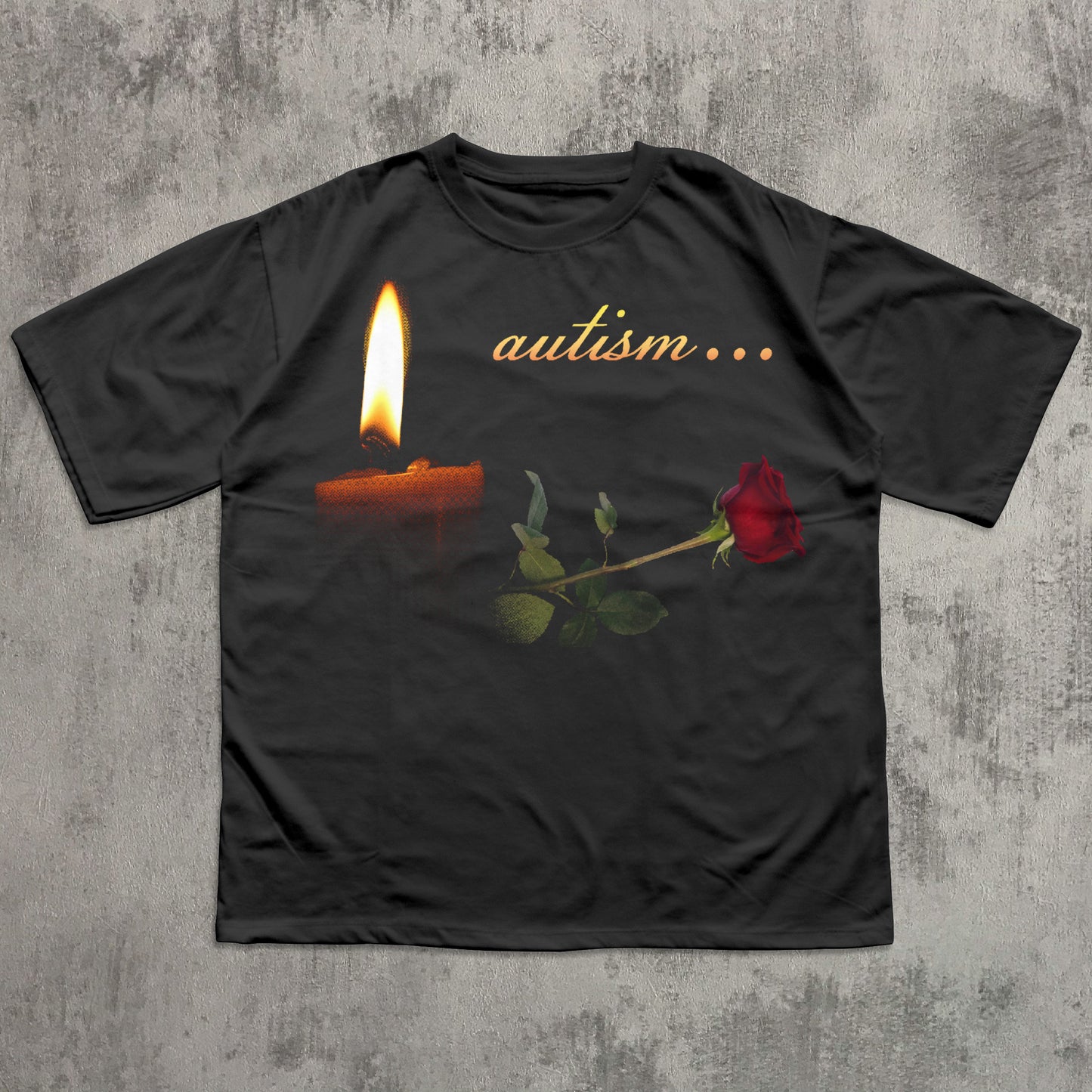 Black t-shirt with a candle and rose graphic and 'autism...' text on a textured gray background