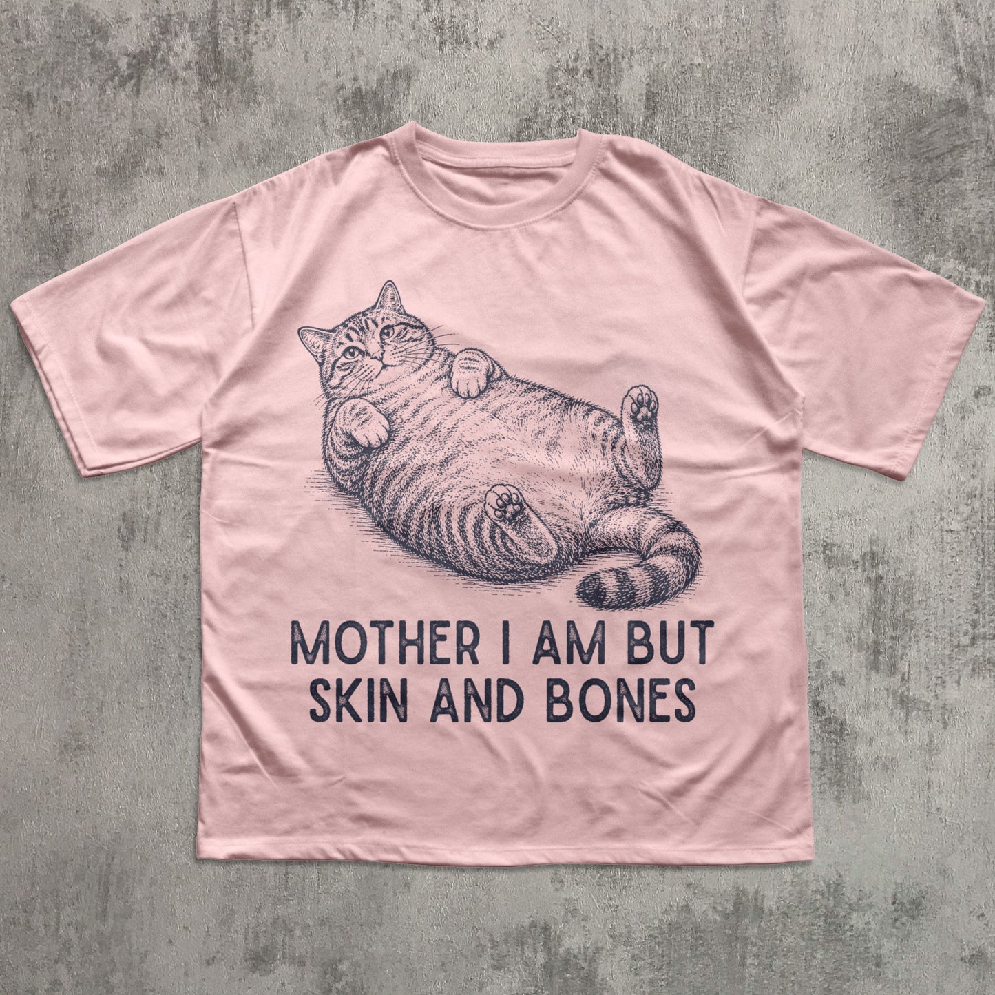 Pink t-shirt with a cat graphic and text on a textured gray background