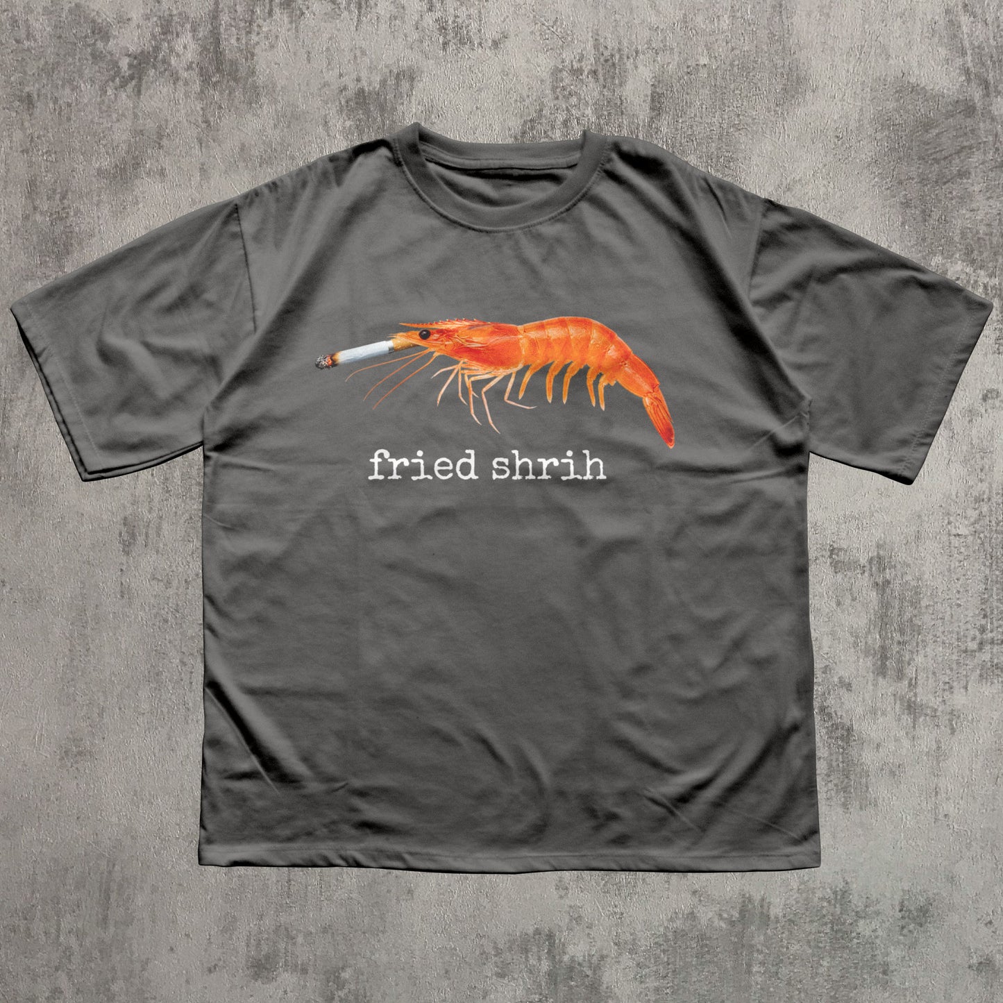 Gray t-shirt with a shrimp graphic and 'fried shrim' text on a textured gray background