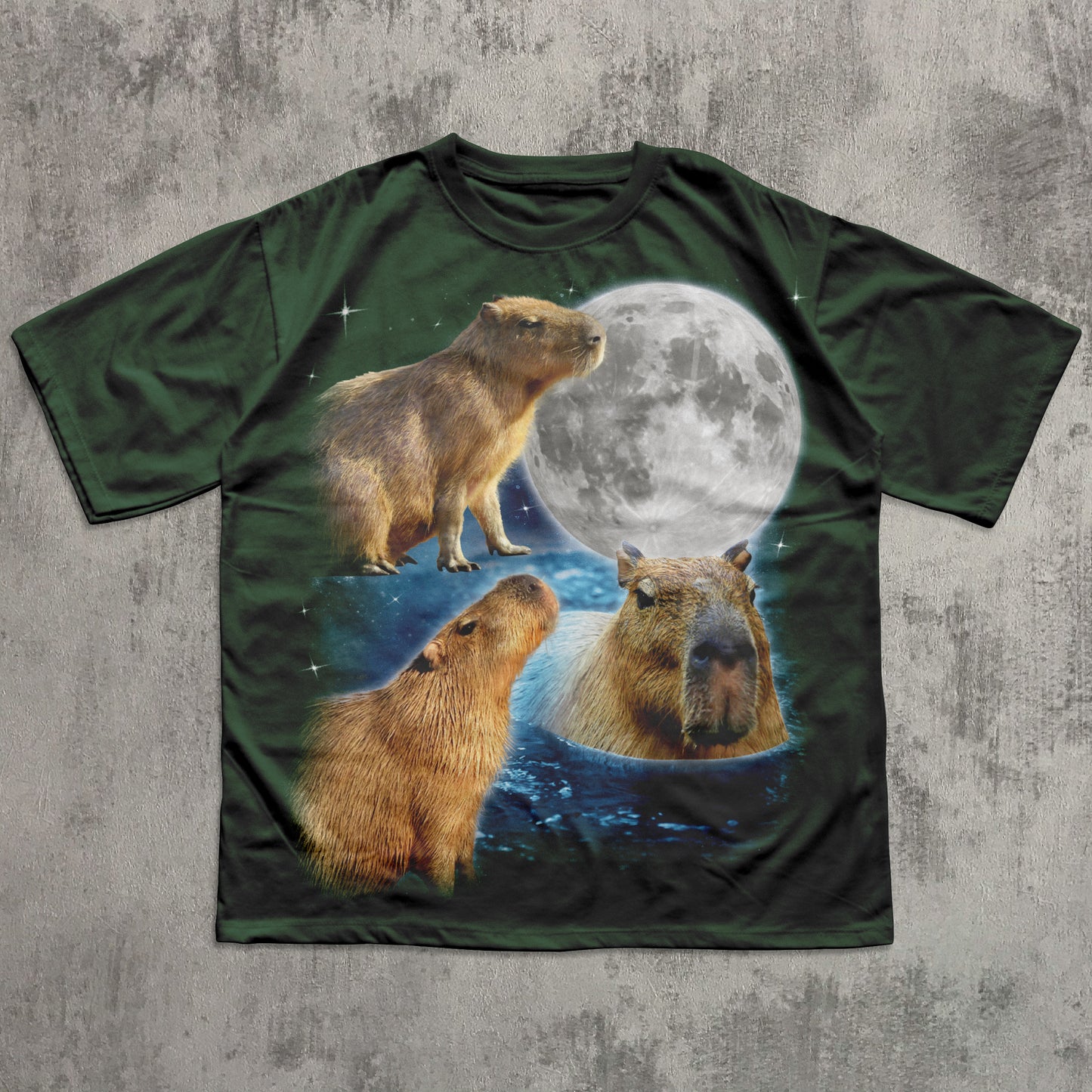 T-shirt with capybara design and moon on a textured gray background