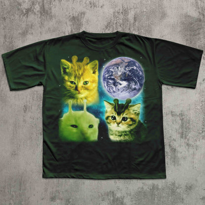 T-shirt with alien cats and Earth design on a textured surface