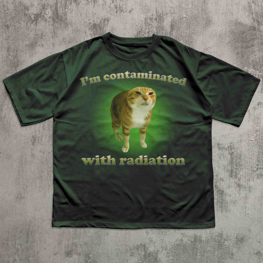 Green t-shirt with a cat graphic and text on a textured gray background