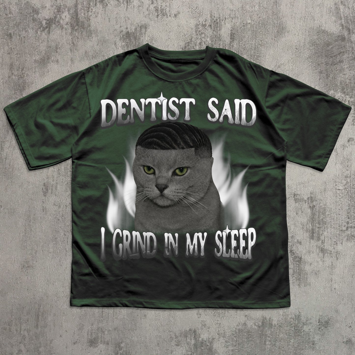 Green t-shirt with a cat graphic and text on a textured gray background
