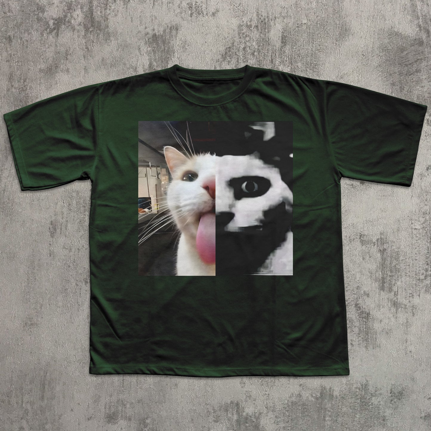 Green t-shirt with a printed design of a cat on a textured gray background
