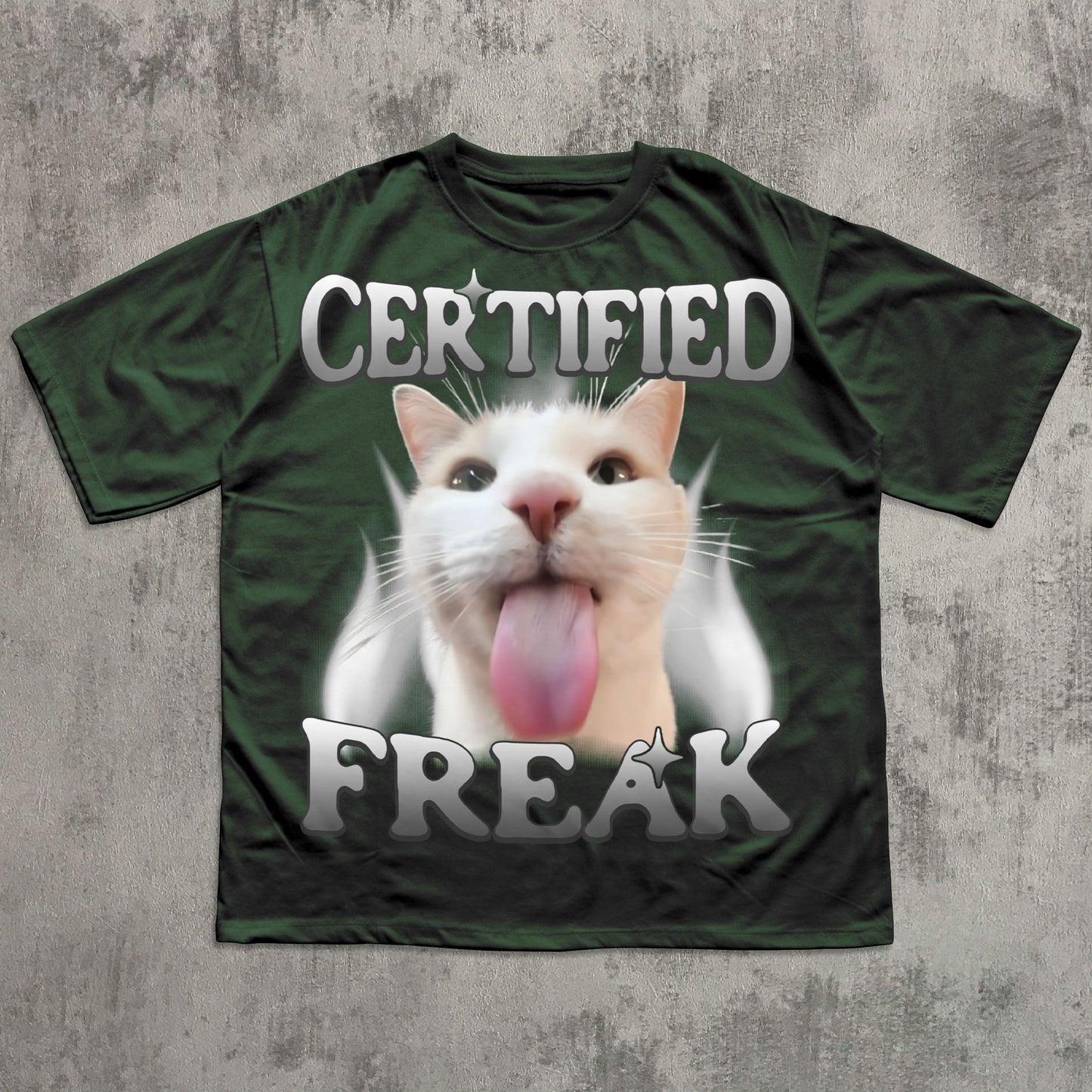 Green t-shirt with a cat graphic and 'Certified Freak' text on a textured gray background