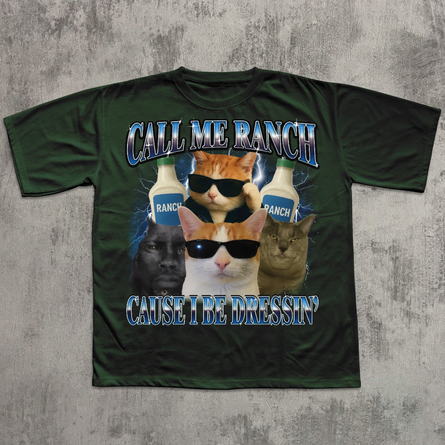 Green t-shirt with cat-themed graphic and text on a textured gray background