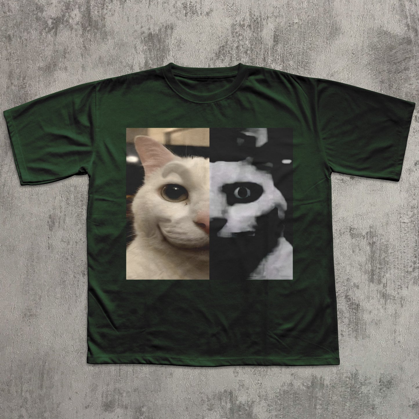Green t-shirt with a cat face design on a textured gray background