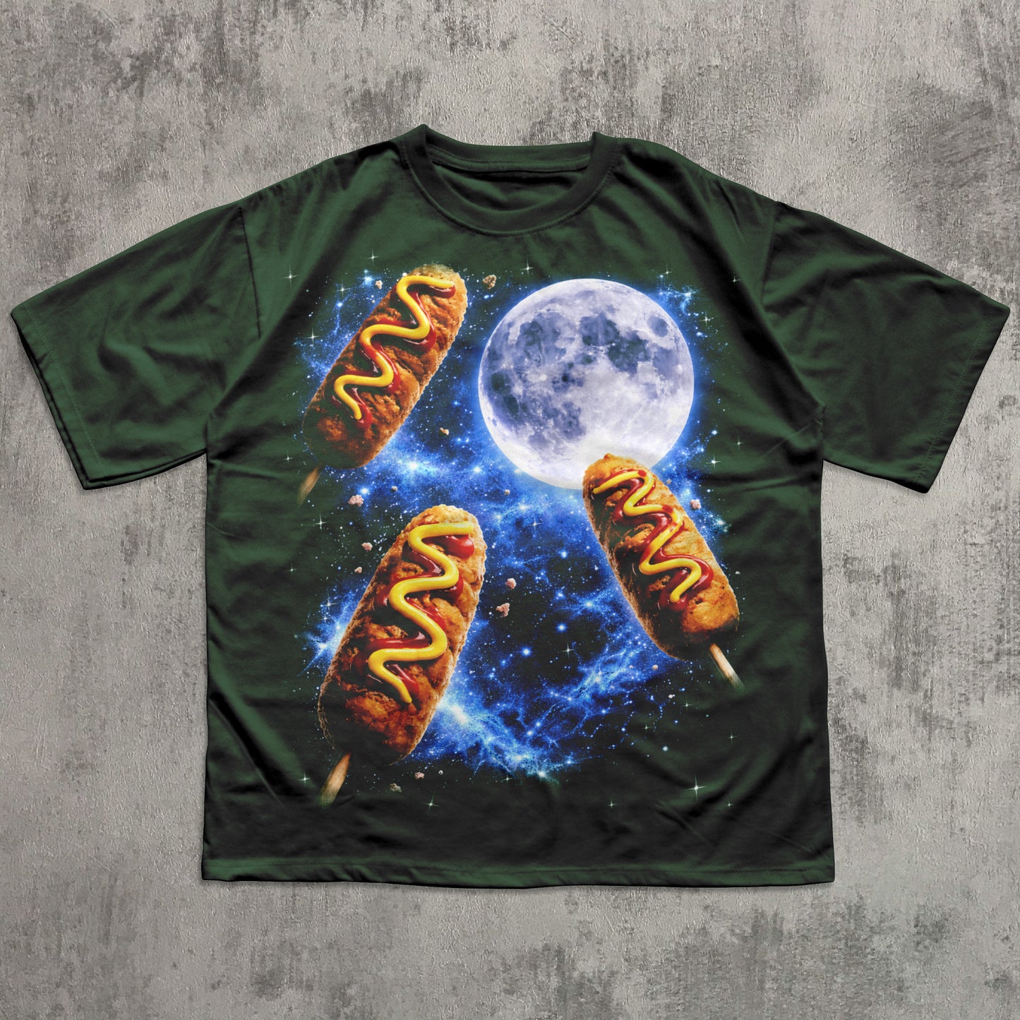 Green t-shirt with hot dog graphic and moon on a textured gray background