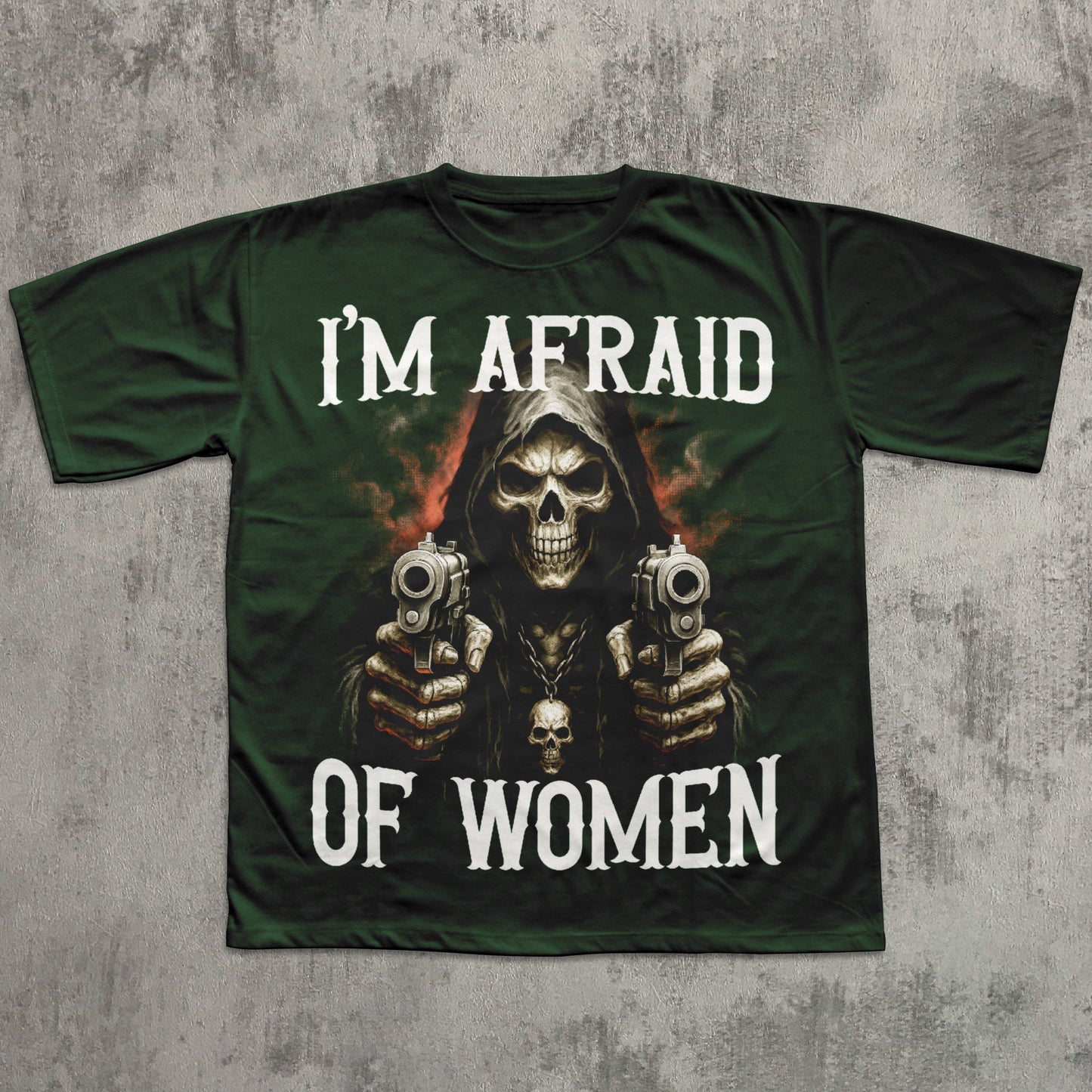 Green t-shirt with a graphic of a skeleton holding guns and text 'I'm Afraid of Women' on a textured gray background.