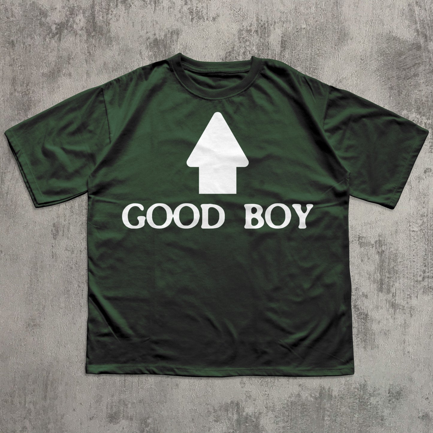 Green t-shirt with 'GOOD BOY' text and white graphic on a textured gray background