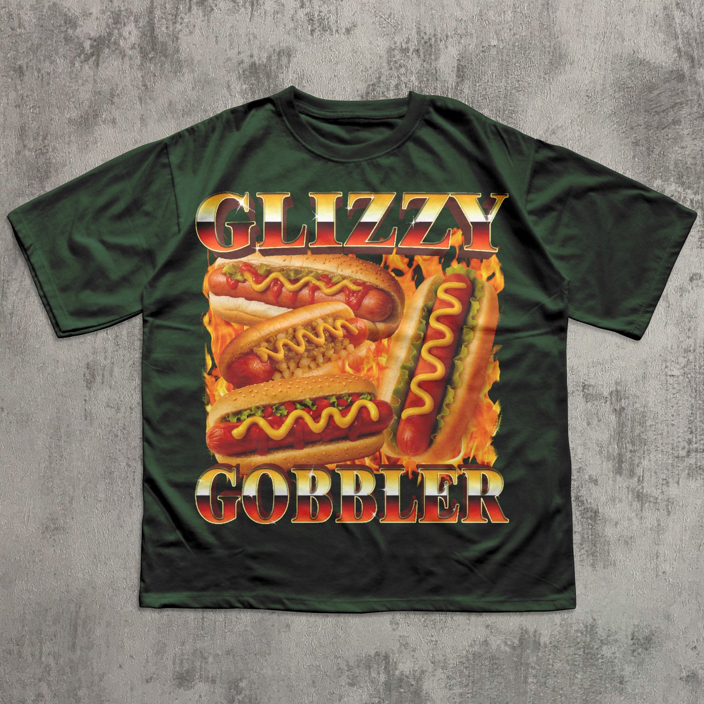 Green t-shirt with 'Glizzy Gobbler' hot dog graphic on a textured gray background