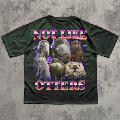 Green t-shirt with otter graphic and text 'Not Like Otters' on a textured gray background