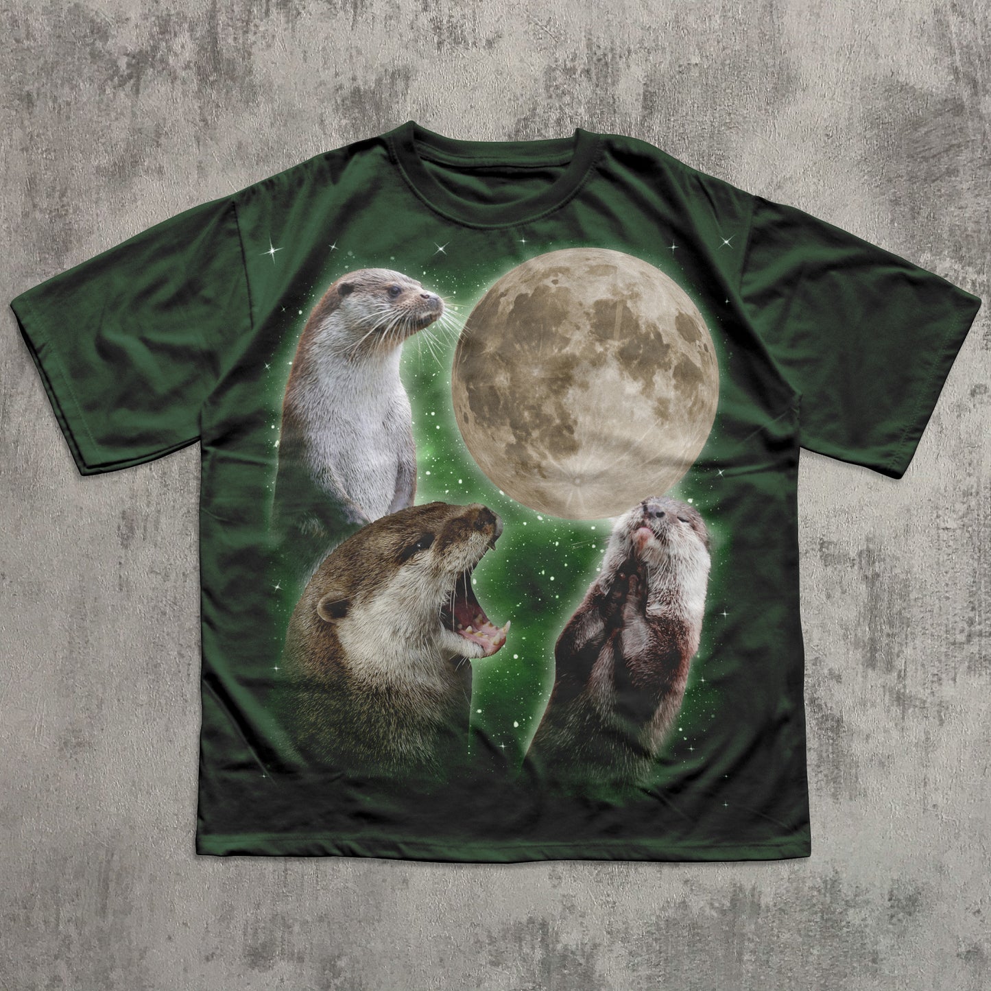 T-shirt with otter and moon design on a textured surface