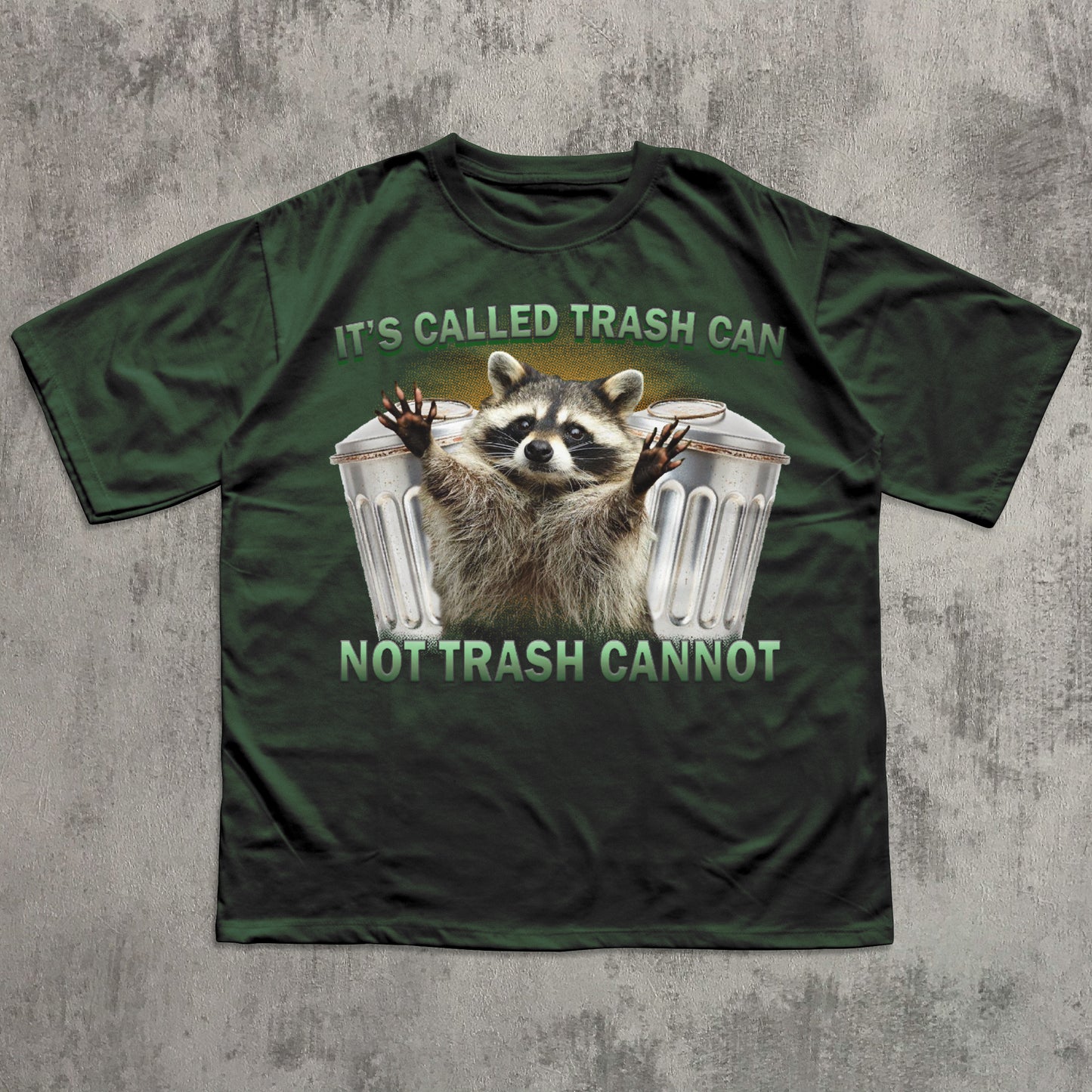 Green t-shirt with a raccoon graphic and text on a textured gray background