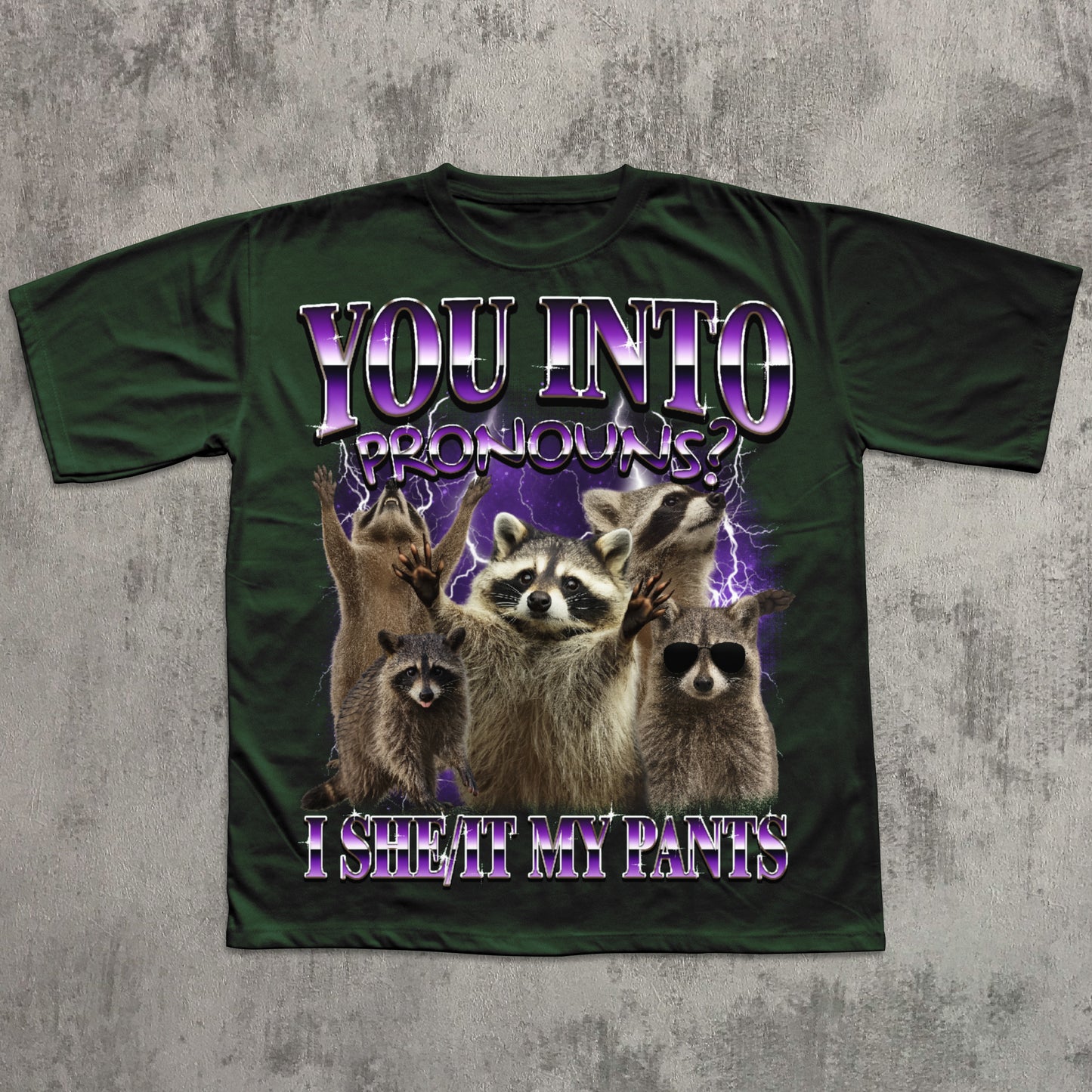 Green t-shirt with raccoon graphic and humorous text on a textured gray background