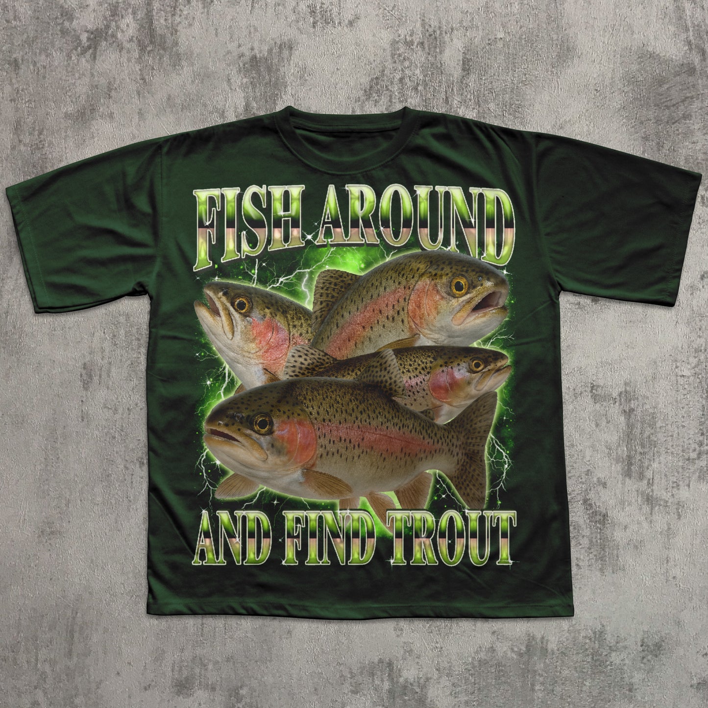 Green t-shirt with fish design and text 'Fish Around and Find Trout' on a textured gray background