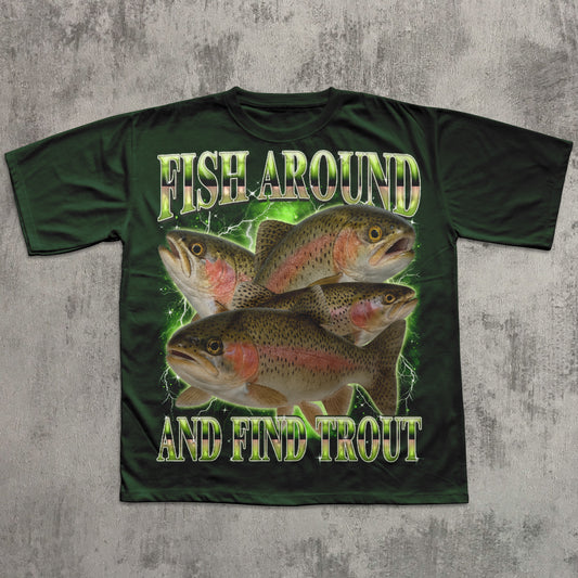 Green t-shirt with fish design and text 'Fish Around and Find Trout' on a textured gray background