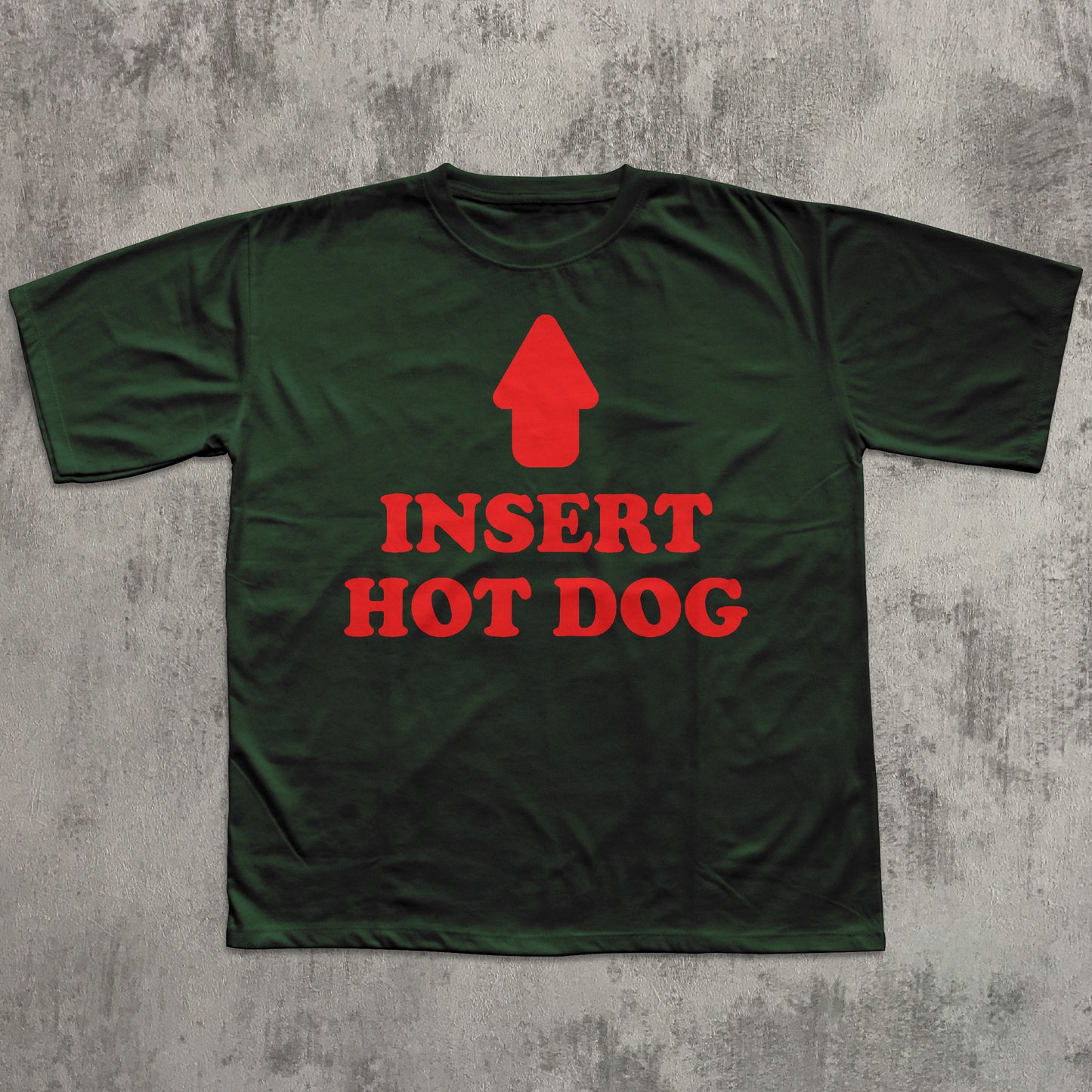 Green t-shirt with red graphic and text 'Insert Hot Dog' on a textured gray background