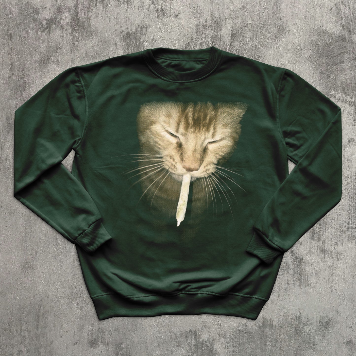 green sweatshirt with a cat graphic on a textured gray background