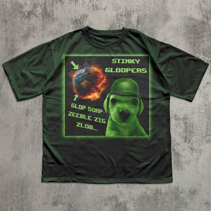 Green funny t-shirt with a graphic design featuring a alien dog in a helmet and text on a concrete background