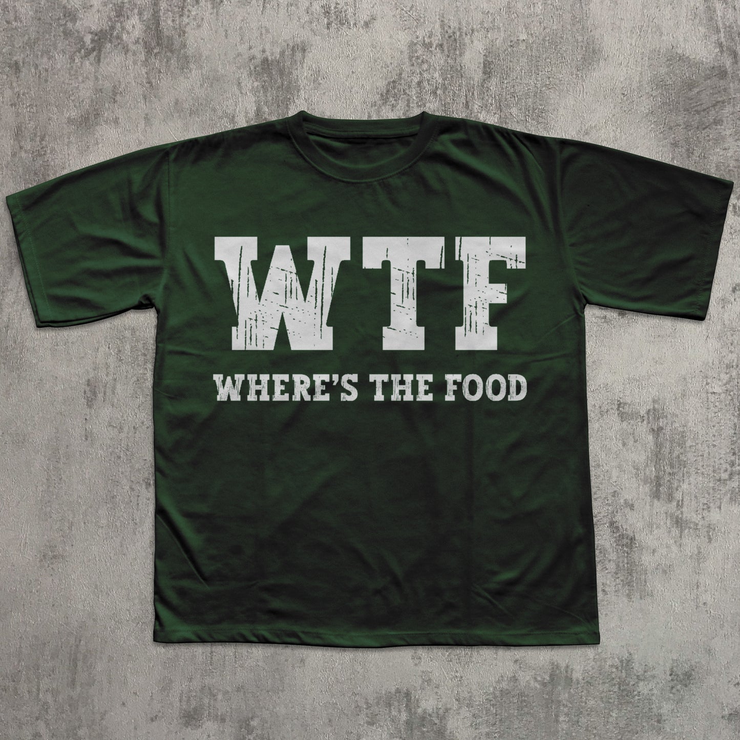 Green t-shirt with 'WTF WHERE'S THE FOOD' text on a textured gray background