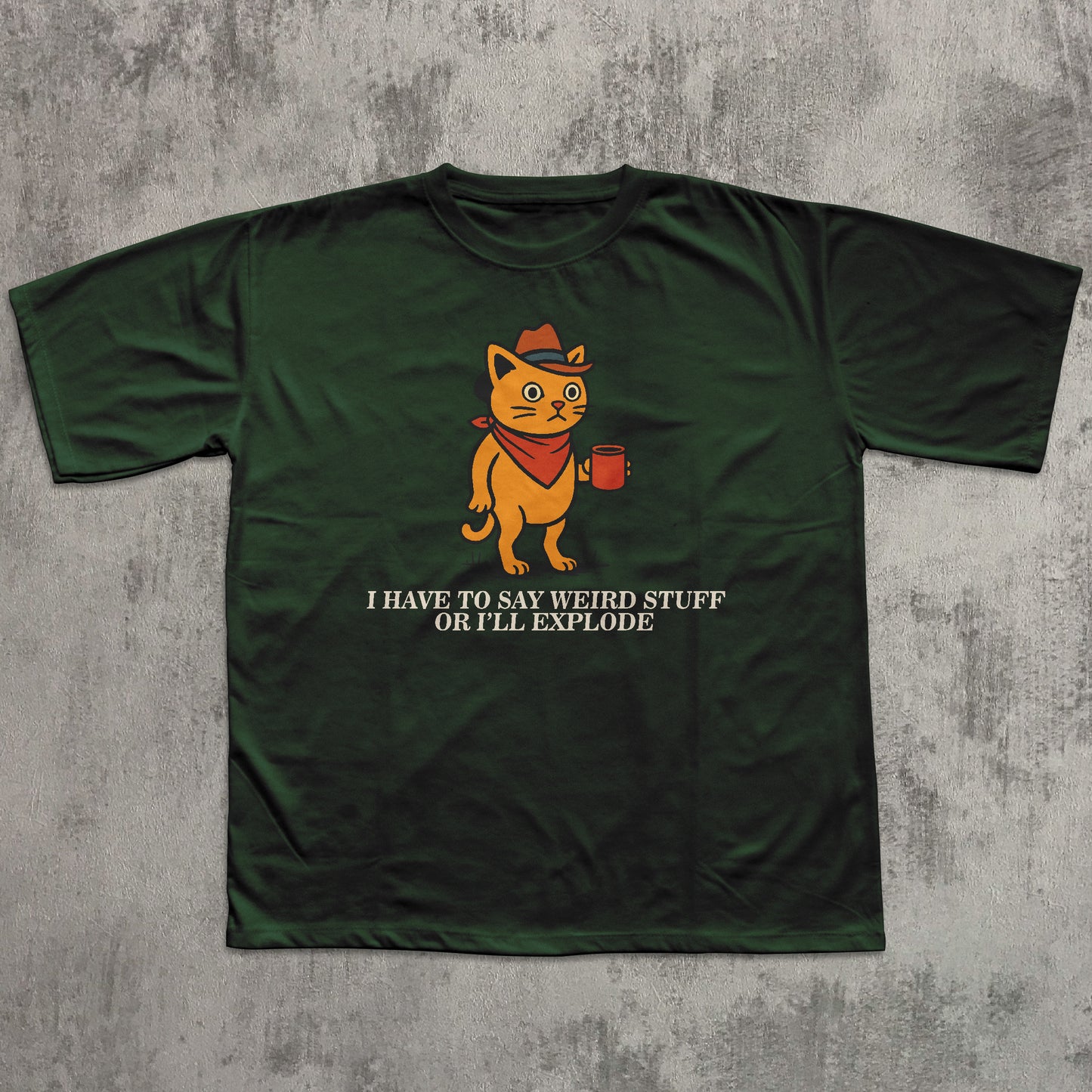 Green t-shirt with a cartoon cat graphic and text on a textured gray background