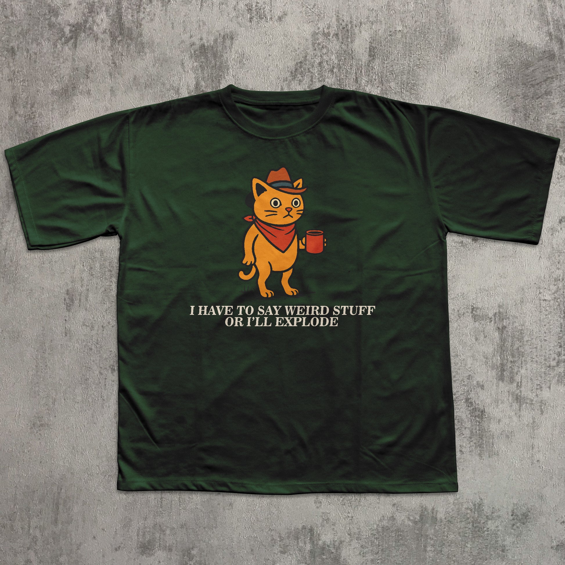 Green t-shirt with a cartoon cat graphic and text on a textured gray background