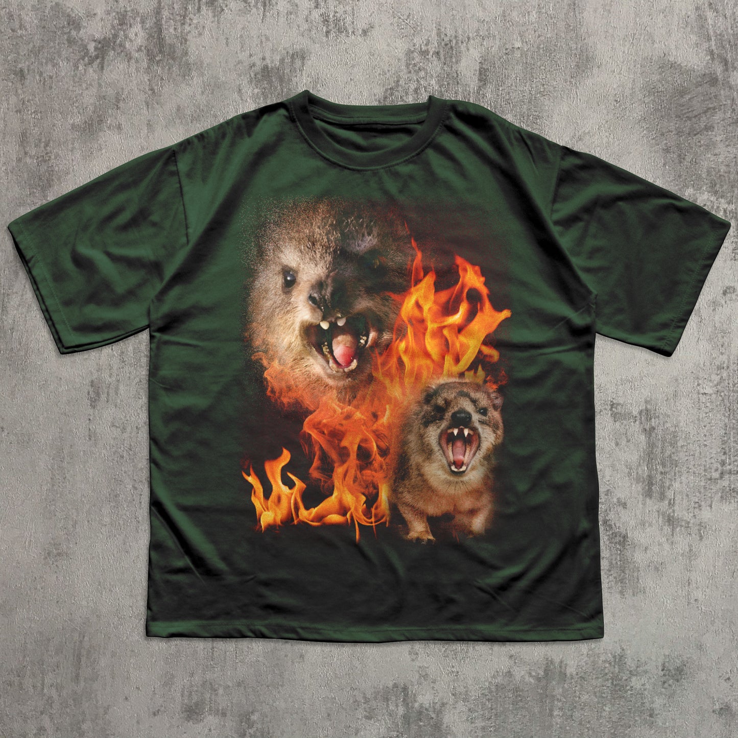 Green t-shirt with a graphic of two hyraxes in flames on a textured gray background
