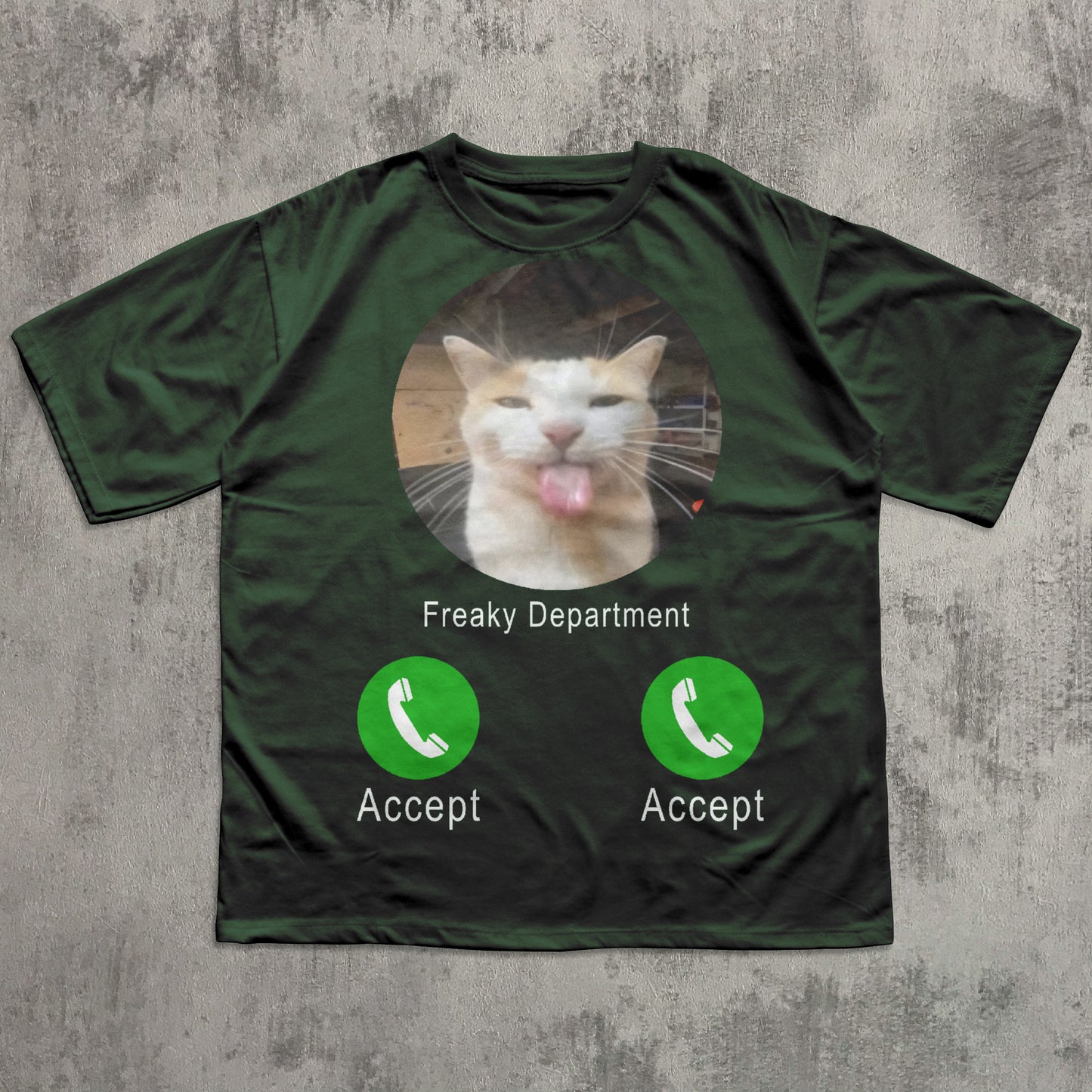 Green t-shirt with a cat graphic and 'Freaky Department' text on a textured gray background