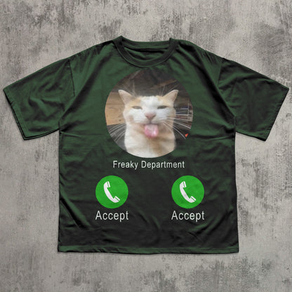 Green t-shirt with a cat graphic and 'Freaky Department' text on a textured gray background