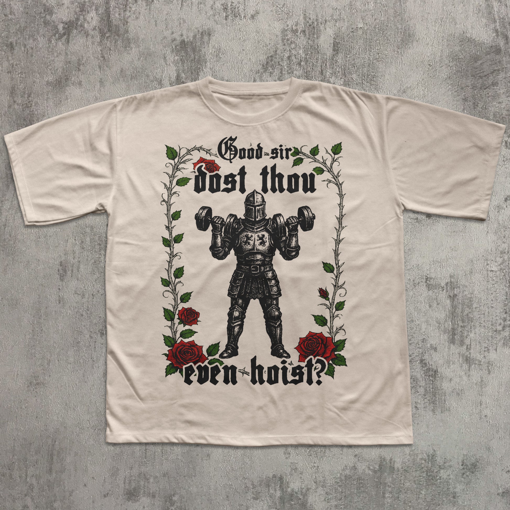 Beige t-shirt with a graphic design of a knight lifting weights and roses on a textured gray background