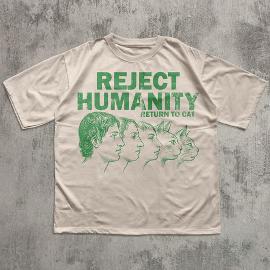 Beige t-shirt with green text and graphic on a textured gray background