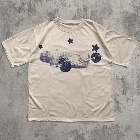 Beige t-shirt with a graphic of a barbell and weights on a textured gray background