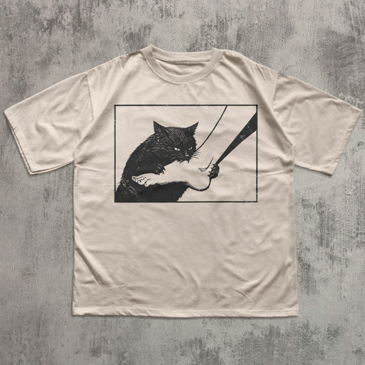 Funny black cat graphic t-shirt with mischievous cat illustration on ivory tee for cat lovers