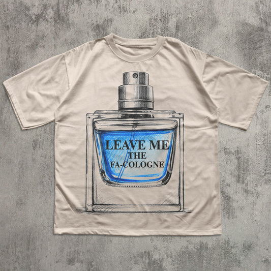 Beige t-shirt with a graphic of a cologne bottle and text 'Leave Me The FA Cologne' on a textured gray background.