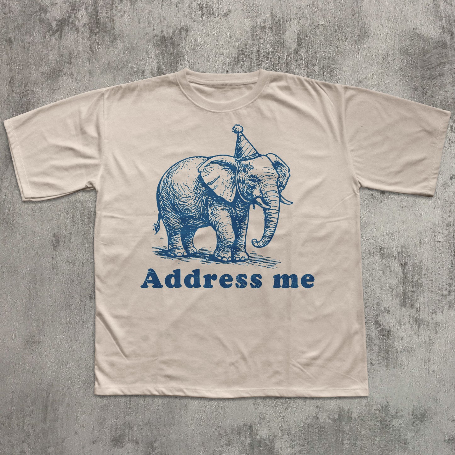 t-shirt with an elephant graphic and 'Address me' text on a textured gray background