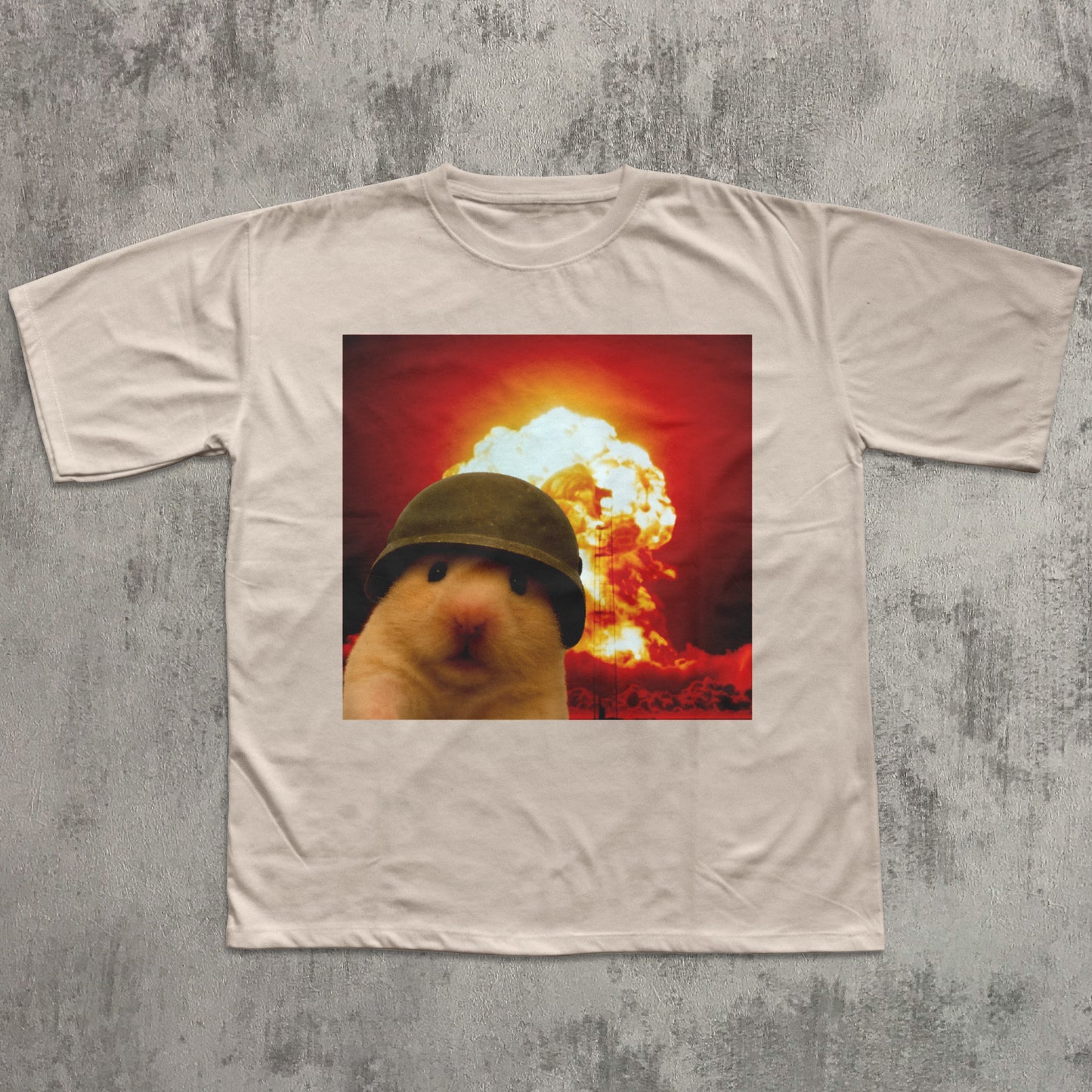 T-shirt with a graphic of a hamster wearing a helmet in front of an explosion on a textured gray background